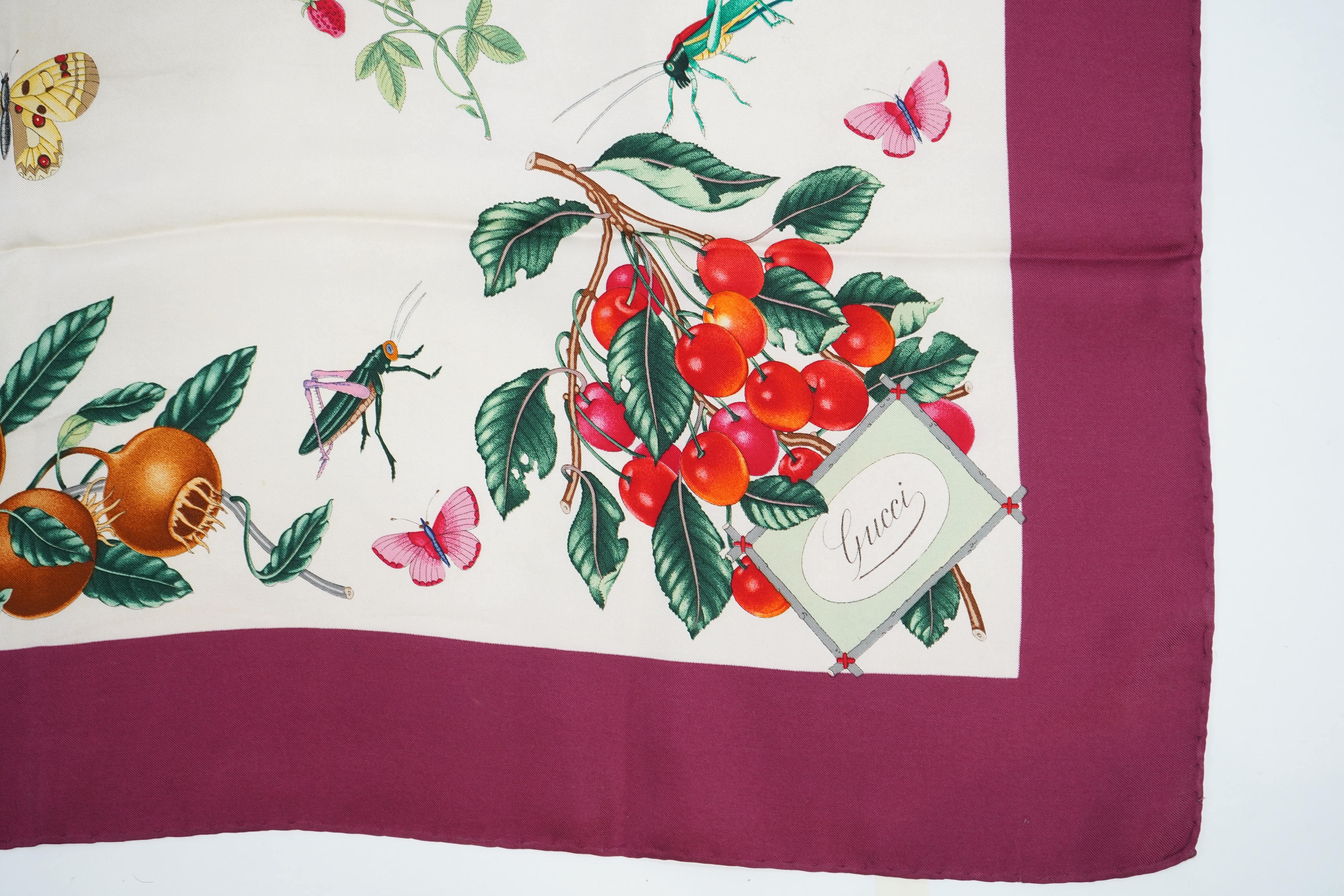 A Gucci Vittorio Accornero silk scarf with fruits and insects design, 87 x 86cm